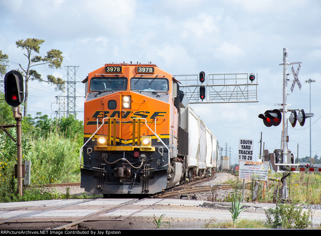 A BNSF train comes souwh through T&NO Junction 